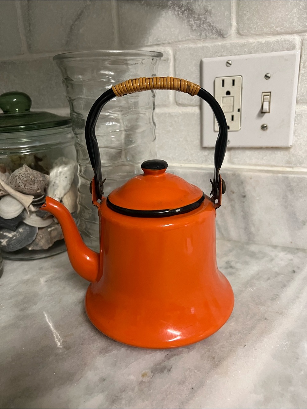 Source Unknown Bright Orange Enamel Teapot with Black Handle and Wicker Grip